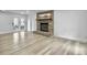Bright living room with hardwood floors, a brick fireplace, and white walls at 112 Huckleberry Ln, Summerville, SC 29485
