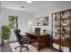 Bright home office with a modern desk, leather chair, and stylish bookshelf at 112 Huckleberry Ln, Summerville, SC 29485