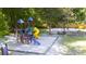 A colorful playground with multiple play structures provides a fun and engaging space for children at 112 Huckleberry Ln, Summerville, SC 29485