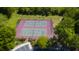 An aerial view of well-maintained community tennis courts, perfect for recreational play and exercise at 112 Huckleberry Ln, Summerville, SC 29485