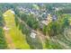 An expansive aerial shot shows the neighborhood's layout and the golf course-adjacent location at 1164 Out Of Bounds Dr, Summerville, SC 29485