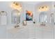 Bright bathroom features double sinks, white cabinets, marble countertops, and modern fixtures at 1164 Out Of Bounds Dr, Summerville, SC 29485
