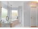 Bright bathroom features marble walk-in shower, soaker tub, and modern fixtures at 1164 Out Of Bounds Dr, Summerville, SC 29485