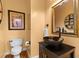 Stylish half bathroom with a dark wood vanity and vessel sink at 1164 Out Of Bounds Dr, Summerville, SC 29485