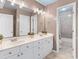Spacious bathroom featuring a double vanity, white cabinets and a tile floor and shower at 1164 Out Of Bounds Dr, Summerville, SC 29485