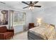 Comfortable bedroom with large window, carpet, ceiling fan, and two chairs at 1164 Out Of Bounds Dr, Summerville, SC 29485