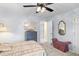 Cozy bedroom featuring a ceiling fan, a decorative mirror and a comfortable bed at 1164 Out Of Bounds Dr, Summerville, SC 29485