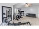 Spacious exercise room with carpet, elliptical machine, rowing machine, desk, and sitting area at 1164 Out Of Bounds Dr, Summerville, SC 29485