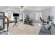 Spacious home gym with varied workout equipment, a ceiling fan and multiple windows at 1164 Out Of Bounds Dr, Summerville, SC 29485