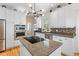 A well-equipped kitchen features granite countertops, stainless steel appliances, and hardwood flooring at 1164 Out Of Bounds Dr, Summerville, SC 29485