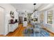 An airy kitchen boasts modern appliances, a breakfast table, and hardwood floors at 1164 Out Of Bounds Dr, Summerville, SC 29485