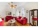 Sophisticated living room featuring arched windows, hardwood floors, and elegant decor at 1164 Out Of Bounds Dr, Summerville, SC 29485