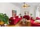 Elegant living room furnished with plush red sofas, a patterned rug, and stylish decor at 1164 Out Of Bounds Dr, Summerville, SC 29485