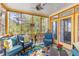 Cozy screened-in porch featuring comfortable seating, a ceiling fan, and outdoor views at 1164 Out Of Bounds Dr, Summerville, SC 29485