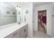 Bathroom with a spacious vanity with great lighting and a door leading to the walk-in closet at 118 Alpine Rd, Summerville, SC 29485