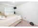 Bedroom with decorated queen-sized bed, window, and TV at 118 Alpine Rd, Summerville, SC 29485
