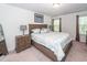 Bright bedroom with a queen-sized bed, soft lighting, and stylish coastal-themed decor at 118 Alpine Rd, Summerville, SC 29485