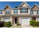 Charming townhouse with a well-maintained yard, attached garage, and inviting curb appeal at 118 Alpine Rd, Summerville, SC 29485