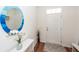 Bright and modern foyer with hardwood floors, a round mirror, and a stylish console table at 118 Alpine Rd, Summerville, SC 29485