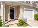 Inviting front entrance featuring a dark wood door, a decorative wreath, and a well-manicured lawn at 118 Alpine Rd, Summerville, SC 29485