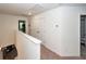 Hallway with access to the bedrooms and bathrooms. Includes carpet floors, white trim and a closet at 118 Alpine Rd, Summerville, SC 29485