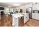 Open concept kitchen featuring stainless steel appliances, a large island, and hardwood flooring at 118 Alpine Rd, Summerville, SC 29485