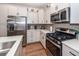Modern kitchen with stainless steel appliances, quartz countertops, and stylish cabinetry at 118 Alpine Rd, Summerville, SC 29485