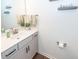 Elegant powder room with a stylish vanity, modern fixtures, and neutral decor at 118 Alpine Rd, Summerville, SC 29485