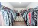 Large walk-in closet with ample hanging space, shelving, and built-in dresser for organized storage at 118 Alpine Rd, Summerville, SC 29485