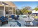 Charming back deck with seating area overlooking the private pool and backyard at 122 Lucia St, Charleston, SC 29492