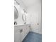 Clean bathroom with double vanity, modern lighting, and blue tile flooring at 122 Lucia St, Charleston, SC 29492