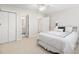 Bright bedroom with a large bed, white walls, closet and bathroom doors at 122 Lucia St, Charleston, SC 29492