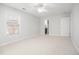 Neutral bedroom features a window, carpet, and a door to the bathroom at 122 Lucia St, Charleston, SC 29492