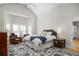 Spacious main bedroom with a vaulted ceiling, accent rug, sitting area and large bed at 122 Lucia St, Charleston, SC 29492