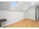Bright, windowed bonus room with hardwood floors and two skylights at 122 Lucia St, Charleston, SC 29492