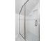 Modern shower with white subway tile, seamless glass doors, and a mosaic-tiled floor at 122 Lucia St, Charleston, SC 29492