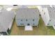 Aerial view showing backyard with a patio and the home's roof, nestled in a suburban neighborhood at 131 Cloverleaf St, Summerville, SC 29483