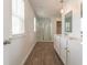 Bathroom with a walk-in shower, dual sink vanity, and wood-look flooring at 131 Cloverleaf St, Summerville, SC 29483