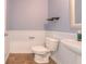Cozy powder room with white wainscoting, pedestal sink, and modern fixtures at 131 Cloverleaf St, Summerville, SC 29483