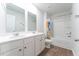 Bright bathroom features a double sink vanity, wood floors and a shower and tub combo at 131 Cloverleaf St, Summerville, SC 29483