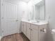 Bathroom features double sinks, wood floors, and bright lighting at 131 Cloverleaf St, Summerville, SC 29483