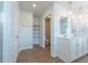 Bathroom featuring a dual sink vanity, wood-look flooring, and open shelving at 131 Cloverleaf St, Summerville, SC 29483