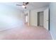 Carpeted bedroom with a ceiling fan features leafy wallpaper and a closet at 131 Cloverleaf St, Summerville, SC 29483