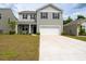 Attractive two-story house with a spacious driveway and an attached two-car garage at 131 Cloverleaf St, Summerville, SC 29483