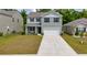 Charming two-story home featuring a large driveway and an attached garage at 131 Cloverleaf St, Summerville, SC 29483