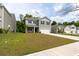 Well-maintained two-story home with a wide driveway and lush green lawn at 131 Cloverleaf St, Summerville, SC 29483