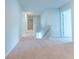Upstairs hallway with neutral walls, carpet, and a staircase leading to the lower level at 131 Cloverleaf St, Summerville, SC 29483