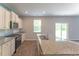 Lovely kitchen with granite counters, stainless appliances, generous storage, and access to the backyard at 131 Cloverleaf St, Summerville, SC 29483