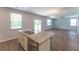Beautiful kitchen island with granite counters, stainless steel appliances, and an open layout to the living room at 131 Cloverleaf St, Summerville, SC 29483