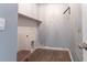 Cozy laundry room features wood-style plank wall and an eye-catching wall stencil pattern at 131 Cloverleaf St, Summerville, SC 29483